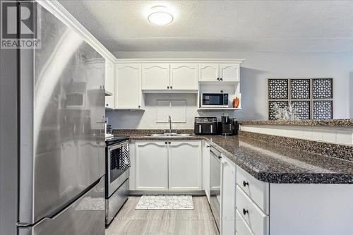 209 - 1411 Walker'S Line, Burlington, ON - Indoor Photo Showing Kitchen With Stainless Steel Kitchen With Upgraded Kitchen