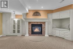 Family room with gas fireplace and built in cupboards - 