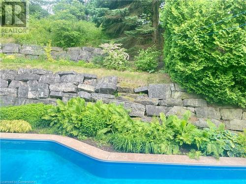 Armour stone tiered backyard - 640 Governors Road, Dundas, ON - Outdoor With In Ground Pool With Backyard