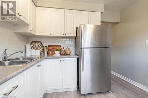 27 Woodman Drive N, Hamilton, ON - Indoor Photo Showing Kitchen With Double Sink