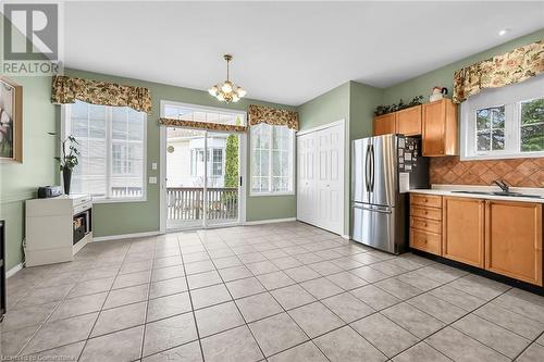 large eat in kitchen with sliding door to rear deck - 244 Silverbirch Boulevard, Mount Hope, ON - Indoor Photo Showing Kitchen