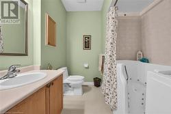 main bathroom with walk-in soaker tub with jets. - 