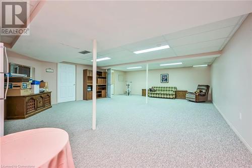 rec room has cedar closet and large workshop/utility room - 244 Silverbirch Boulevard, Mount Hope, ON - Indoor Photo Showing Basement