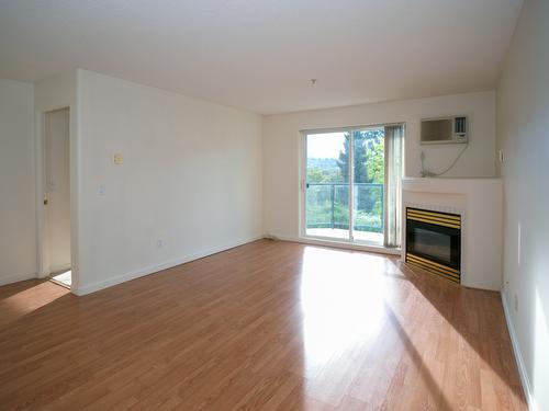 110-3221 Centennial Drive, Vernon, BC - Indoor Photo Showing Other Room With Fireplace