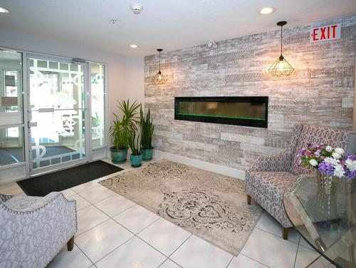 110-3221 Centennial Drive, Vernon, BC - Indoor Photo Showing Living Room With Fireplace