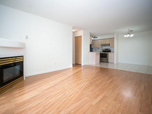 110-3221 Centennial Drive, Vernon, BC - Indoor Photo Showing Living Room With Fireplace