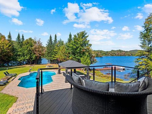 Vue sur l'eau - 4855 Ch. Du Lac-Théodore, Morin-Heights, QC - Outdoor With Body Of Water With In Ground Pool With Deck Patio Veranda With View