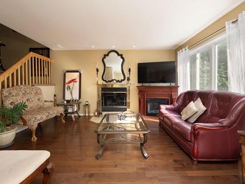 Living room - 485 Rue D'Aubervilliers, Terrebonne (Terrebonne), QC - Indoor Photo Showing Living Room With Fireplace