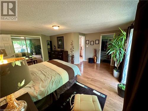 Master bedroom with his and hers closet and walk-in closet,  5 piece en-suite w/Jacuzzi tub and shower - 16 Flamingo Drive, Hamilton, ON - Indoor Photo Showing Bedroom