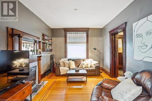 10 Huntley Street, Hamilton, ON - Indoor Photo Showing Living Room With Fireplace