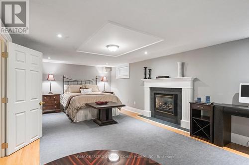 15 Hillholm Road, Toronto, ON - Indoor Photo Showing Bedroom With Fireplace