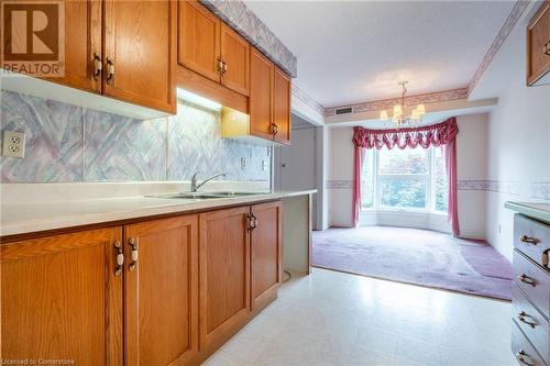 416 Limeridge Road E Unit# 212, Hamilton, ON - Indoor Photo Showing Kitchen With Double Sink