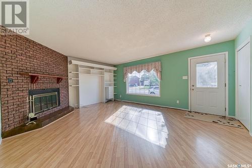 97 Edelweiss Crescent, Moose Jaw, SK - Indoor Photo Showing Living Room With Fireplace