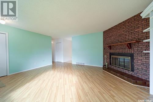 97 Edelweiss Crescent, Moose Jaw, SK - Indoor Photo Showing Living Room With Fireplace