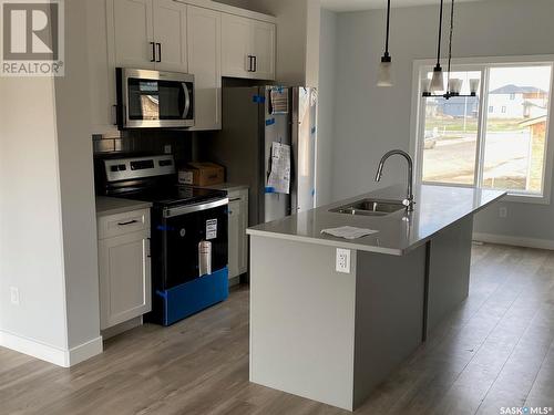 927 Brighton Gate, Saskatoon, SK - Indoor Photo Showing Kitchen With Double Sink