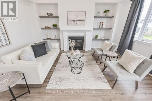 70 Harpin Way W, Centre Wellington (Fergus), ON - Indoor Photo Showing Living Room With Fireplace