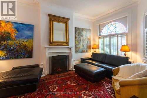 107 Cowan Avenue, Toronto (South Parkdale), ON - Indoor Photo Showing Living Room With Fireplace