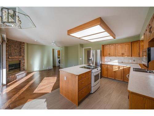 3333 South Main Street Unit# 129, Penticton, BC - Indoor Photo Showing Kitchen With Fireplace With Double Sink