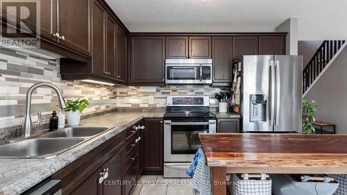 18 Leesboro Trail, Thames Centre (Thorndale), ON - Indoor Photo Showing Kitchen With Double Sink