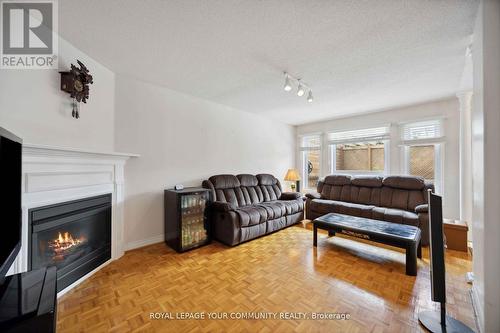 67 Waterbury Street, Caledon, ON - Indoor Photo Showing Living Room With Fireplace