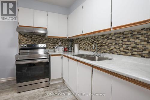 212 - 75 Emmett Avenue, Toronto (Mount Dennis), ON - Indoor Photo Showing Kitchen With Double Sink