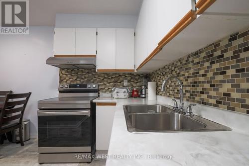 212 - 75 Emmett Avenue, Toronto (Mount Dennis), ON - Indoor Photo Showing Kitchen With Double Sink