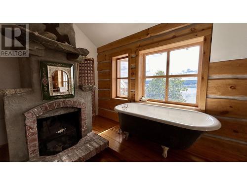 4802 Hamilton Road, Lac La Hache, BC - Indoor Photo Showing Bathroom With Fireplace