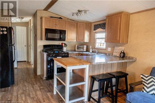 1501 Line 8 Road Unit# 142, Niagara-On-The-Lake, ON - Indoor Photo Showing Kitchen With Double Sink