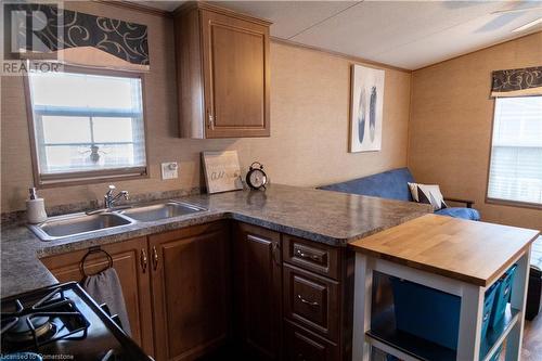 1501 Line 8 Road Unit# 142, Niagara-On-The-Lake, ON - Indoor Photo Showing Kitchen With Double Sink