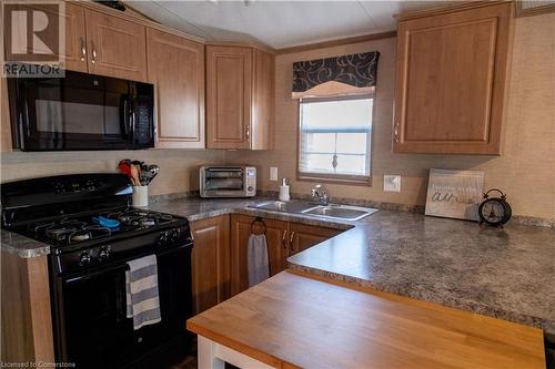 1501 Line 8 Road Unit# 142, Niagara-On-The-Lake, ON - Indoor Photo Showing Kitchen With Double Sink