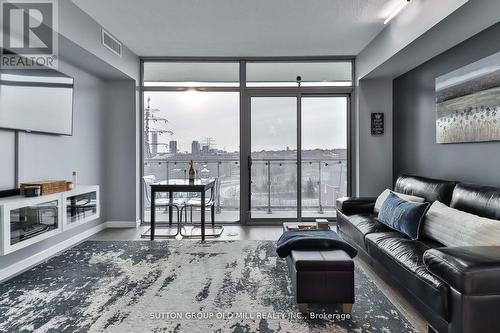 506 - 105 The Queensway, Toronto (High Park-Swansea), ON - Indoor Photo Showing Living Room With Fireplace