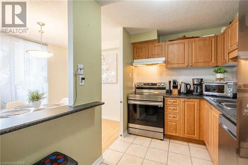 2900 Battleford Road Unit# 504, Mississauga, ON - Indoor Photo Showing Kitchen With Double Sink