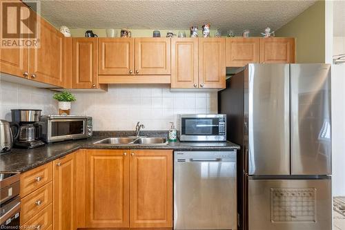 2900 Battleford Road Unit# 504, Mississauga, ON - Indoor Photo Showing Kitchen With Double Sink