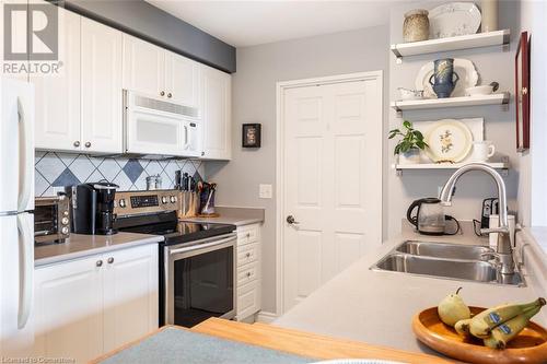 2300 Parkhaven Boulevard Unit# 407, Oakville, ON - Indoor Photo Showing Kitchen With Double Sink