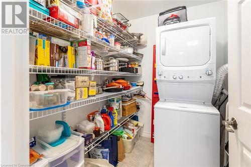 storage and laundry - 2300 Parkhaven Boulevard Unit# 407, Oakville, ON - Indoor Photo Showing Laundry Room