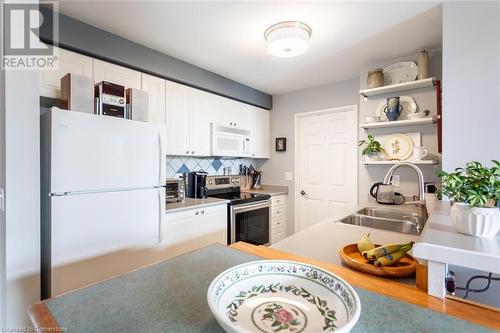 2300 Parkhaven Boulevard Unit# 407, Oakville, ON - Indoor Photo Showing Kitchen With Double Sink