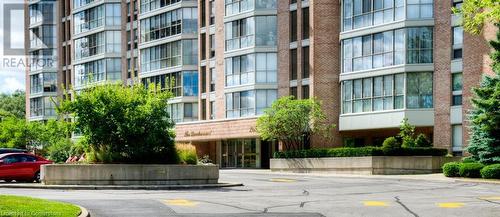 front doors of building - 265 Westcourt Place Unit# 802, Waterloo, ON - Outdoor With Facade