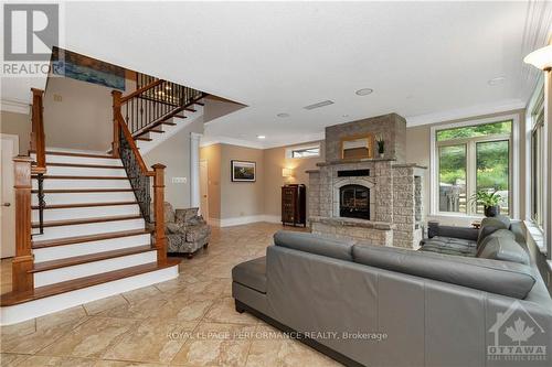 101 Arthur Road, Tay Valley, ON - Indoor Photo Showing Living Room With Fireplace