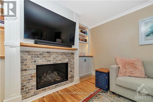 101 Arthur Road, Tay Valley, ON - Indoor Photo Showing Living Room With Fireplace