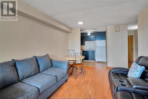 150 Park Unit# 1706, Windsor, ON - Indoor Photo Showing Living Room With Fireplace