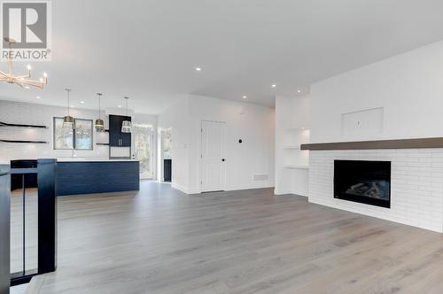 1113 Collinson Court, Kelowna, BC - Indoor Photo Showing Living Room With Fireplace