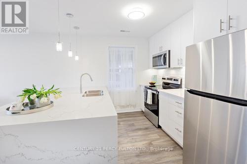 2 - 391 Royal York Road, Toronto (Mimico), ON - Indoor Photo Showing Kitchen With Double Sink With Upgraded Kitchen