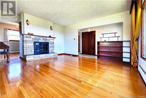 119 Route 100, Nauwigewauk, NB - Indoor Photo Showing Living Room With Fireplace