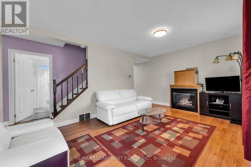 18 Eaton Place, Hamilton (Mcquesten), ON - Indoor Photo Showing Living Room With Fireplace