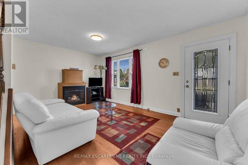 18 Eaton Place, Hamilton (Mcquesten), ON - Indoor Photo Showing Living Room With Fireplace