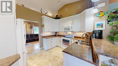 14441 Red Creek Road, Fort St. John, BC - Indoor Photo Showing Kitchen With Double Sink