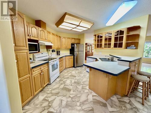 9918 115 Avenue, Fort St. John, BC - Indoor Photo Showing Kitchen With Double Sink