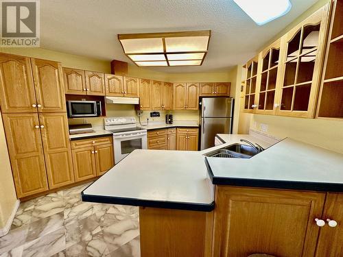 9918 115 Avenue, Fort St. John, BC - Indoor Photo Showing Kitchen With Double Sink