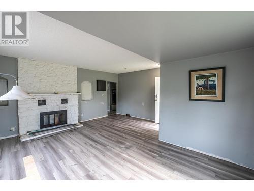 8046 River Road, Oliver, BC - Indoor Photo Showing Living Room With Fireplace