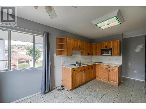 8046 River Road, Oliver, BC - Indoor Photo Showing Kitchen With Double Sink